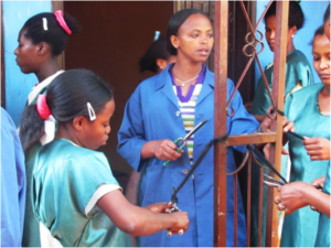 Nigatuwa teaching hairdressing skills to trainees