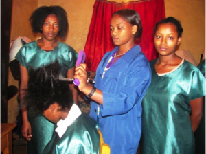 Nigatuwa fixing hair with trainees